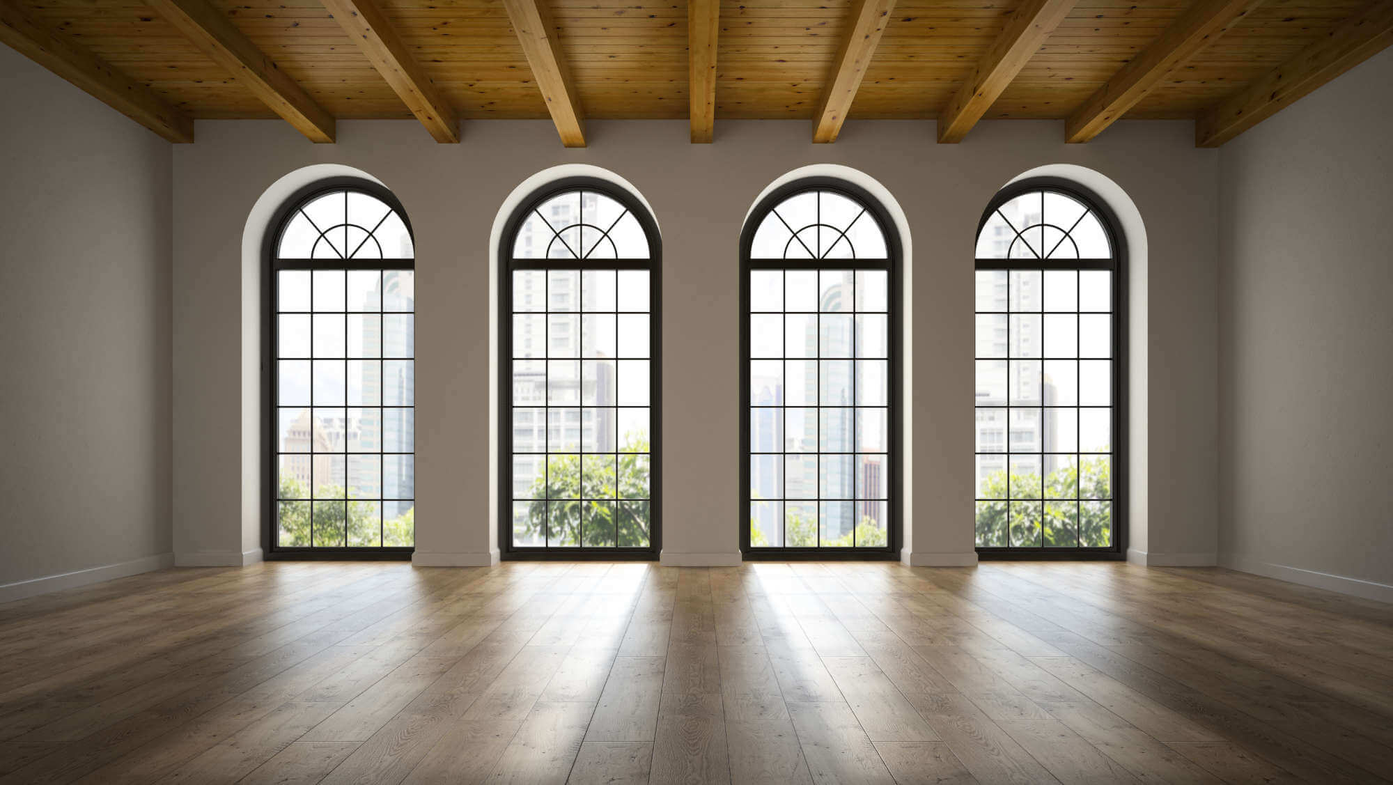 6474eab02f89309c943428d9_empty-loft-room-with-arc-windows